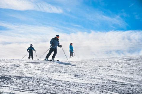 Three man skiing down the ski slope in Pyrenees Mountains, Andorra Foto stock