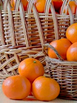 Three Mandarin basket background Stock Photos