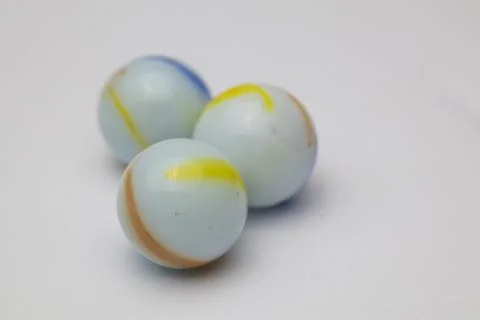 Three marble balls on a white background. Foto stock