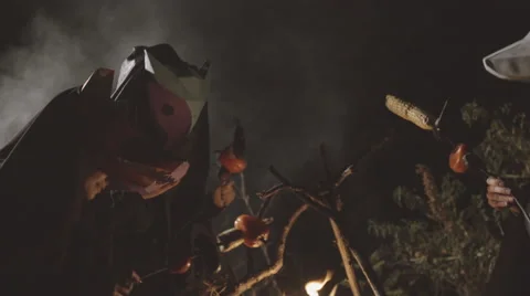 Three masked people barbecuing vegetables Stock Footage 59357734