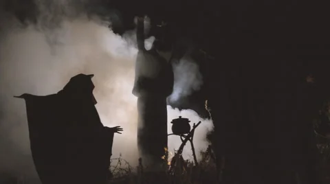 Three masked withes by the fire Stock Footage 59368261