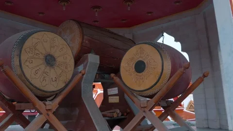 Three massive traditional Thai temple drums and bells are situated in the temple Stock Footage 308896286