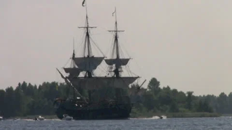 A three-masted sailing goes on the river Stock Footage 26621917