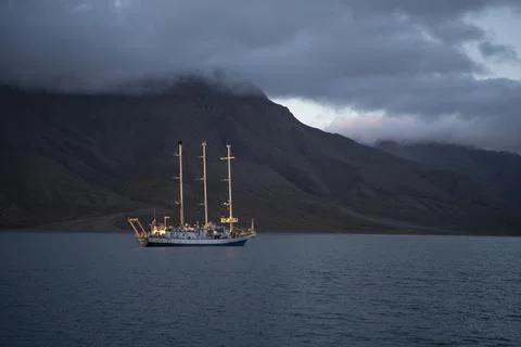 Three masted ship sailing the arctic waters of Svalbard Islands, Norway 写真素材