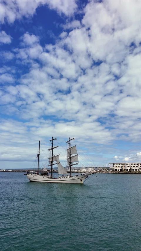 Three-masted tall ship sailing during Hanse Sail festival in Warnemunde harbor. Stock Footage 341987876