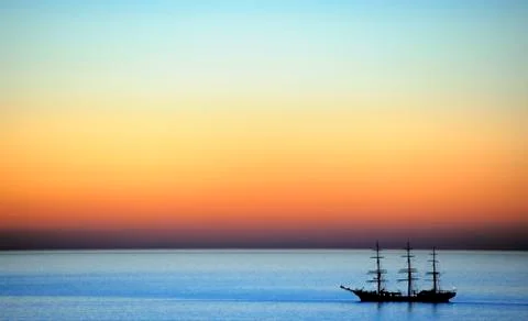 Three-master at sunset Stock Photos