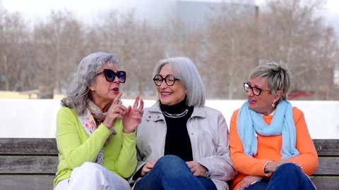 Three mature friends having fun while telling gossip. Stock Footage 270455048