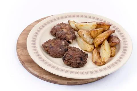 Three meatballs with fried potatoes Stock Photos