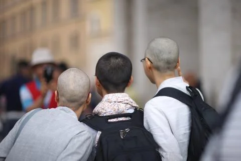 Three men are photographed while visiting European sights Stock Photos