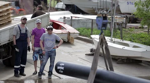 Three men on the bank discuss Stock Footage 54028318