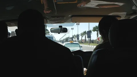 Three men drive in a car. back view Stock Footage 101005100