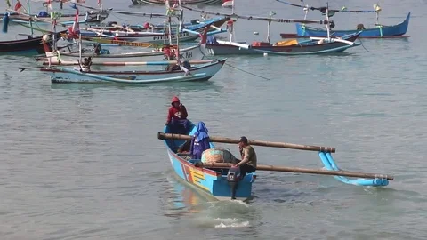 Three Men Floating In A Traditional Indonesian Motor Boat Stock Footage 85336993