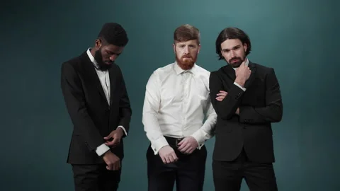 Three men friends are posing and looking at the camera seriously Stock Footage 170673584