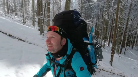 Three Men Hiking Up A Mountain On A Trail On A Winter Hike Video stock 219950455