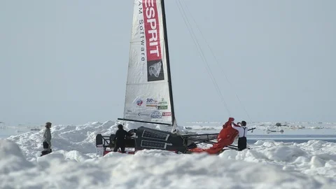 Three men preparing a catamaran on the ice floe, Arctic Ocean Stock Footage 104916403