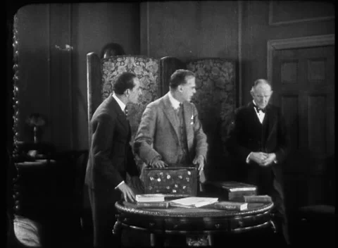 Three men in room worried talking about patients health, United Kingdom, 1923 Stock Footage 172219755