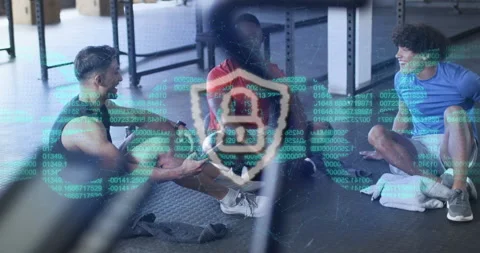 Three men sitting gym mat chatting starting scrolling code securing data pulsing Stock Footage 314738272