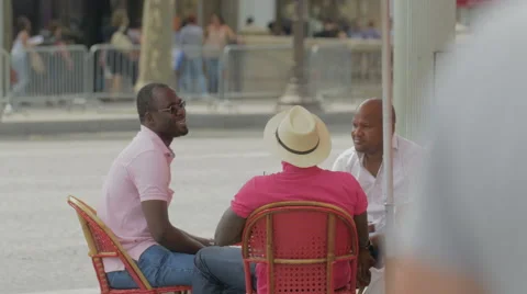 Three men sitting at a table at Le Madrigal restaurant, Paris Stock Footage 56314077
