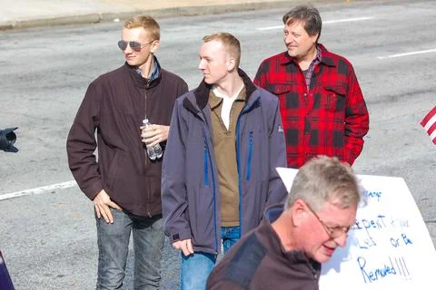 Three men standing together Stock Photos