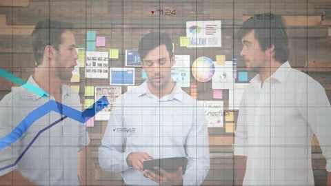 Three men tapping tablet, showing animated graphs in business meeting to review Stockbeeldmateriaal 312071667