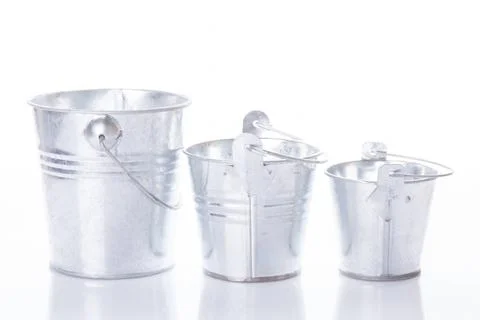 Three metal buckets Three different in size empty buckets on a white backg... Stock Photos