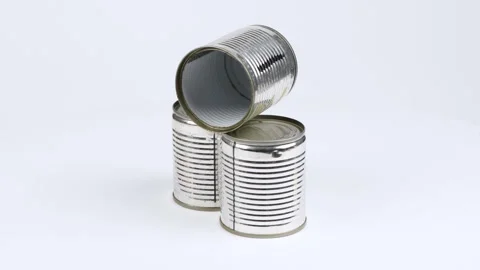 Three metal cans on a white background. Side view. Loop motion. Stock Footage 245076241