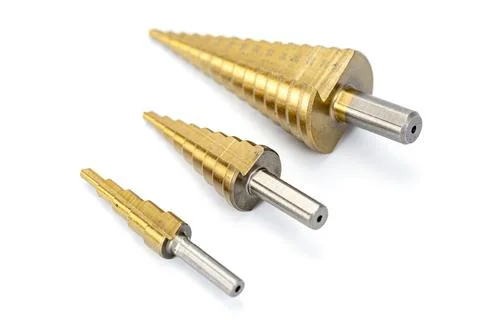 Three Metal Step Drill Bits in Various Sizes on White Background Stock Photos