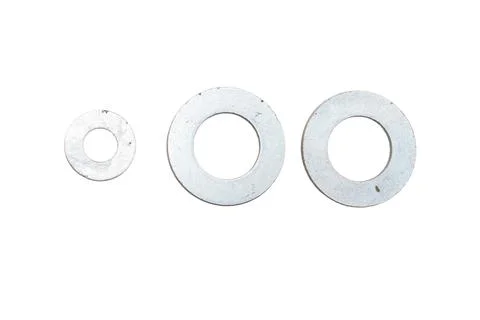 Three Metallic Flat Washers of Different Sizes Isolated on White Background Stock Photos