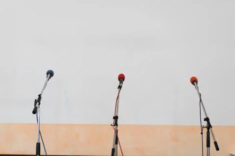 Three microphones on stands Stock Photos