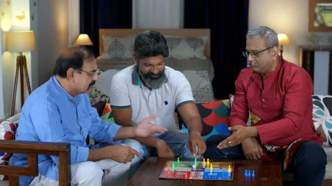 Three middle-aged Indian men in their late forties playing a board game - rol... Video stock 202109593