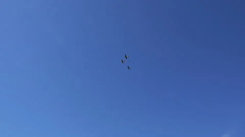 Three military aircraft make a loop high in the sky Stock Footage 95072950