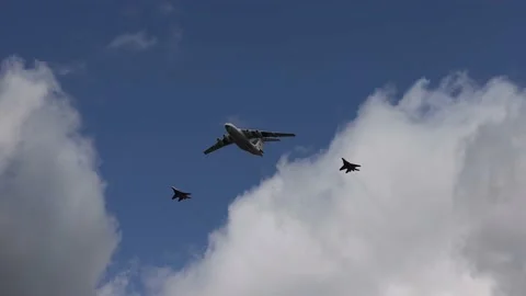 Three military planes fly over Moscow during a rehearsal for the May 9 victory Stock Footage 190358331