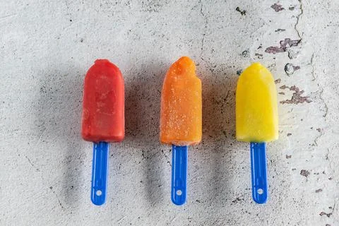 Three mini colored ice creams on white background Stock Photos