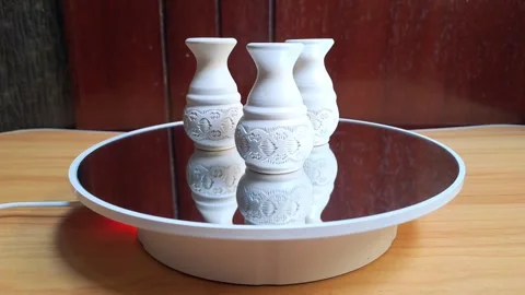 Three miniature white ceramic vases for souvenirs with circular ornaments Stock Footage 341309239