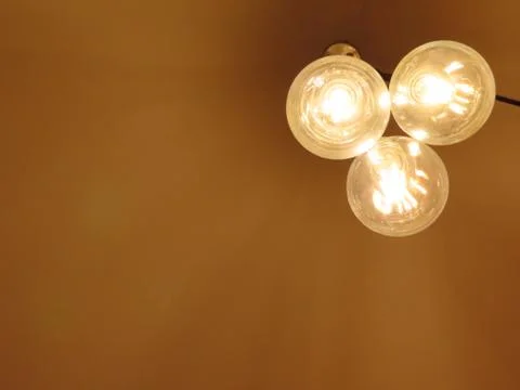 Three modern lightbulbs Stock Photos
