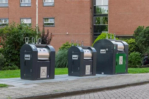 Three modern underground waste containers, for different types of recycling,  Stock Photos