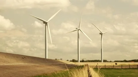 Three modern windmills on the Grevelingenmeer Stock Footage 252176570