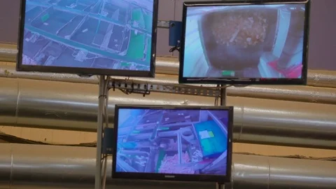 Three monitors showing the different processing inside the sawmill Stock Footage 74870565