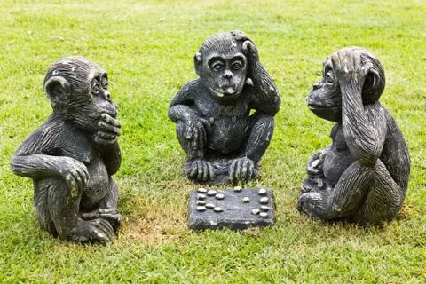 Three monkeys playing checkers Stock Photos