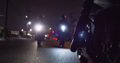 Three Motorcycles Drive Towards Camera at Night Video stock 71787637