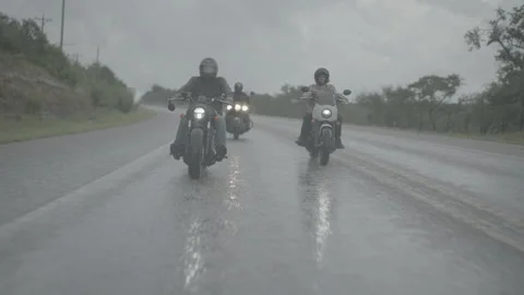 Three motorcycles on the wet road Stock Footage 323478231