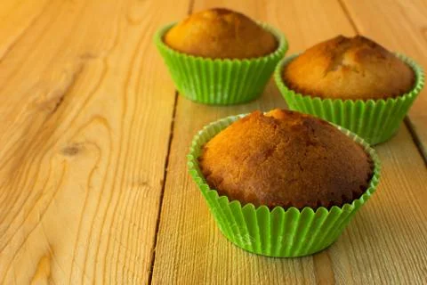 Three muffins in green Stock Photos