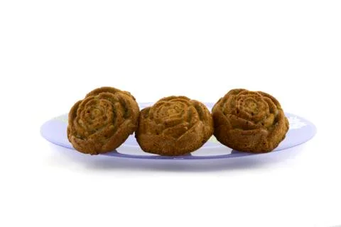 Three muffins on a plate Stock Photos