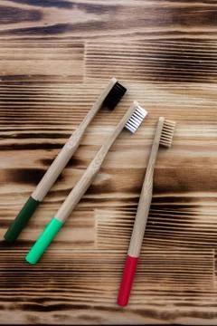 Three multi-colored bamboo toothbrushes Foto stock