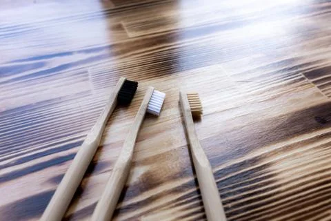 Three multi-colored bamboo toothbrushes Stock Photos