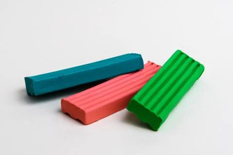 Three multi-colored bars of children's plasticine Stock Photos