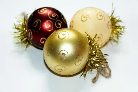 Three multi-colored Christmas decorations in the shape of a balloon Stock Photos