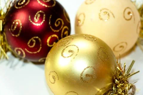 Three multi-colored Christmas decorations in the shape of a balloon Stock Photos