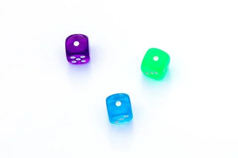 Three multi-colored dice with number one on the sides on white background Stock Photos
