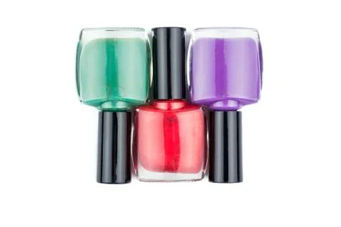 Three multi-colored nail polish Stock-Fotos